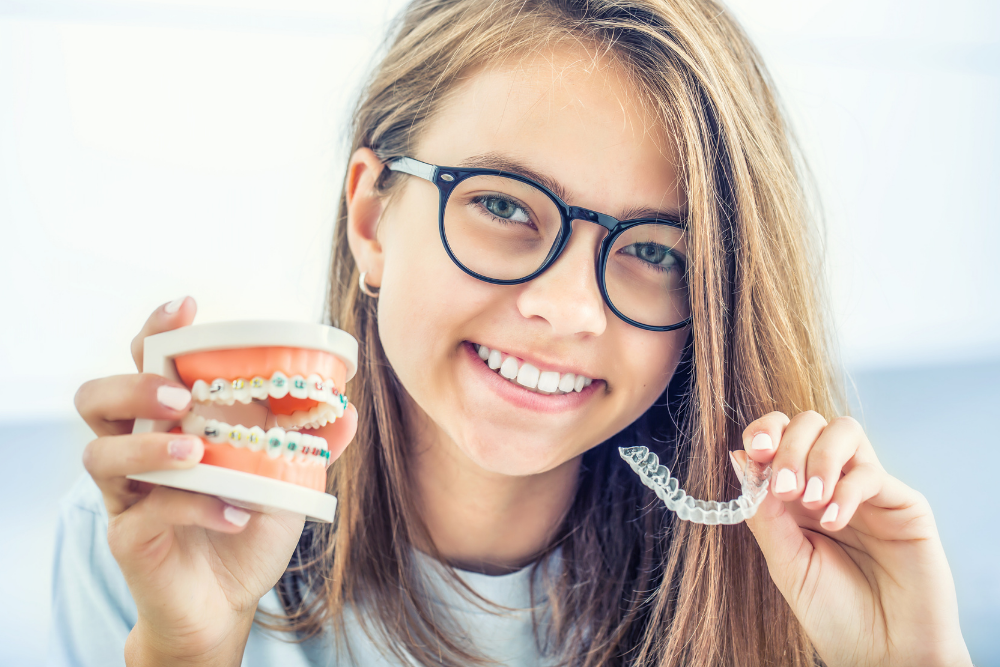 Patient comparing Invisalign clear aligners with traditional fixed braces