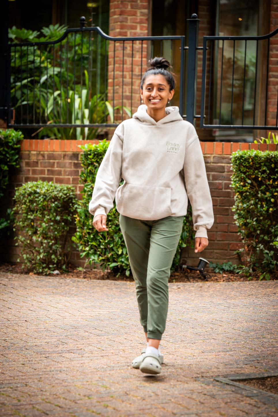 Principal dentist Punita Shah walking outside the Purley dental clinic