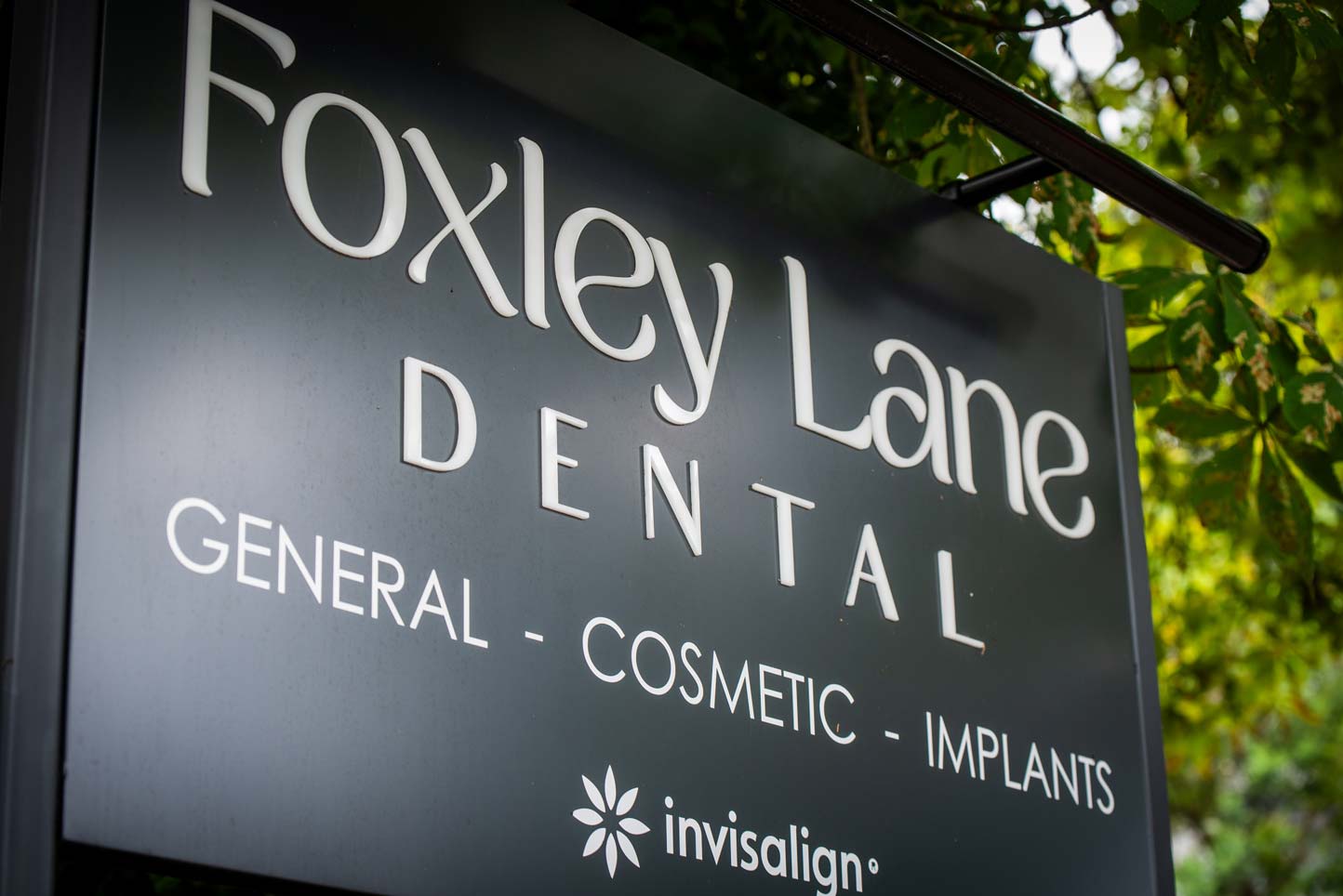 Sign for Foxley Lane Dental highlighting general, cosmetic and implant treatments