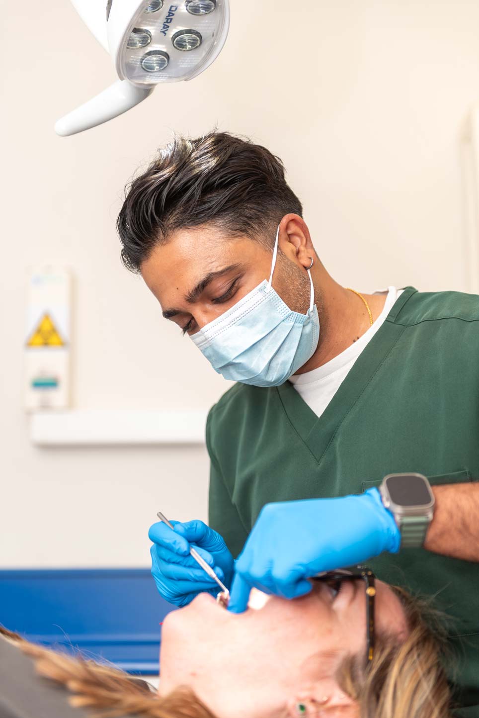 Dr Patel carrying out a routine dental check-up during a general dentistry appointment.