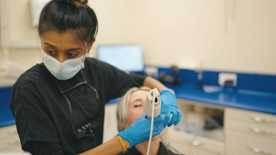 Routine dental check-up with a local family dentist near me in Purley, using modern tools for a comfortable visit