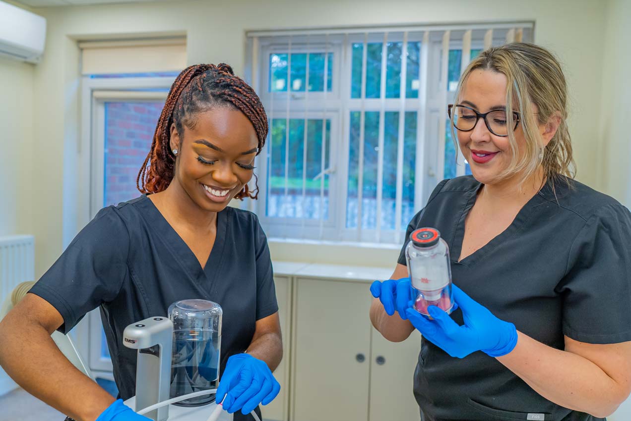 Dental therapist preparing Guided Biofilm Therapy equipment at Foxley Lane Dental, offering advanced dental hygiene near me in Purley