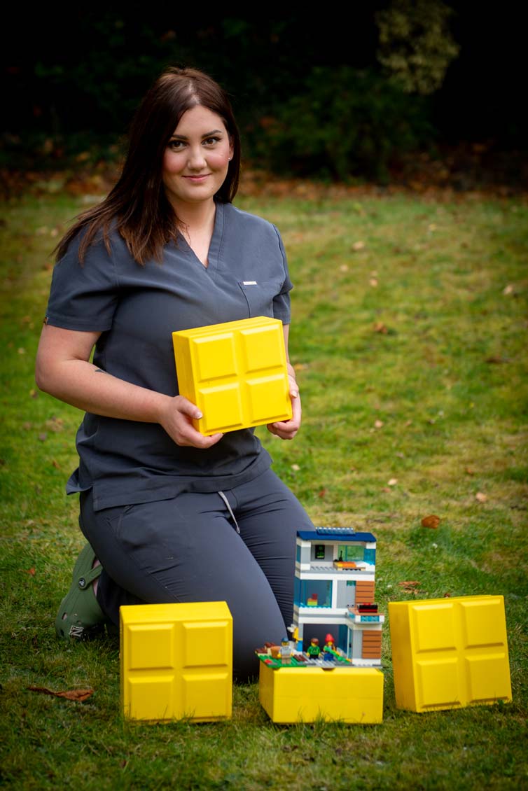 Dental team member Natalia holding children’s play blocks to support a relaxed, child-friendly dental experience in Purley