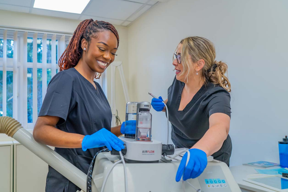 Dental hygienists preparing EMS AirFlow stain removal treatment at Foxley Lane Dental Purley