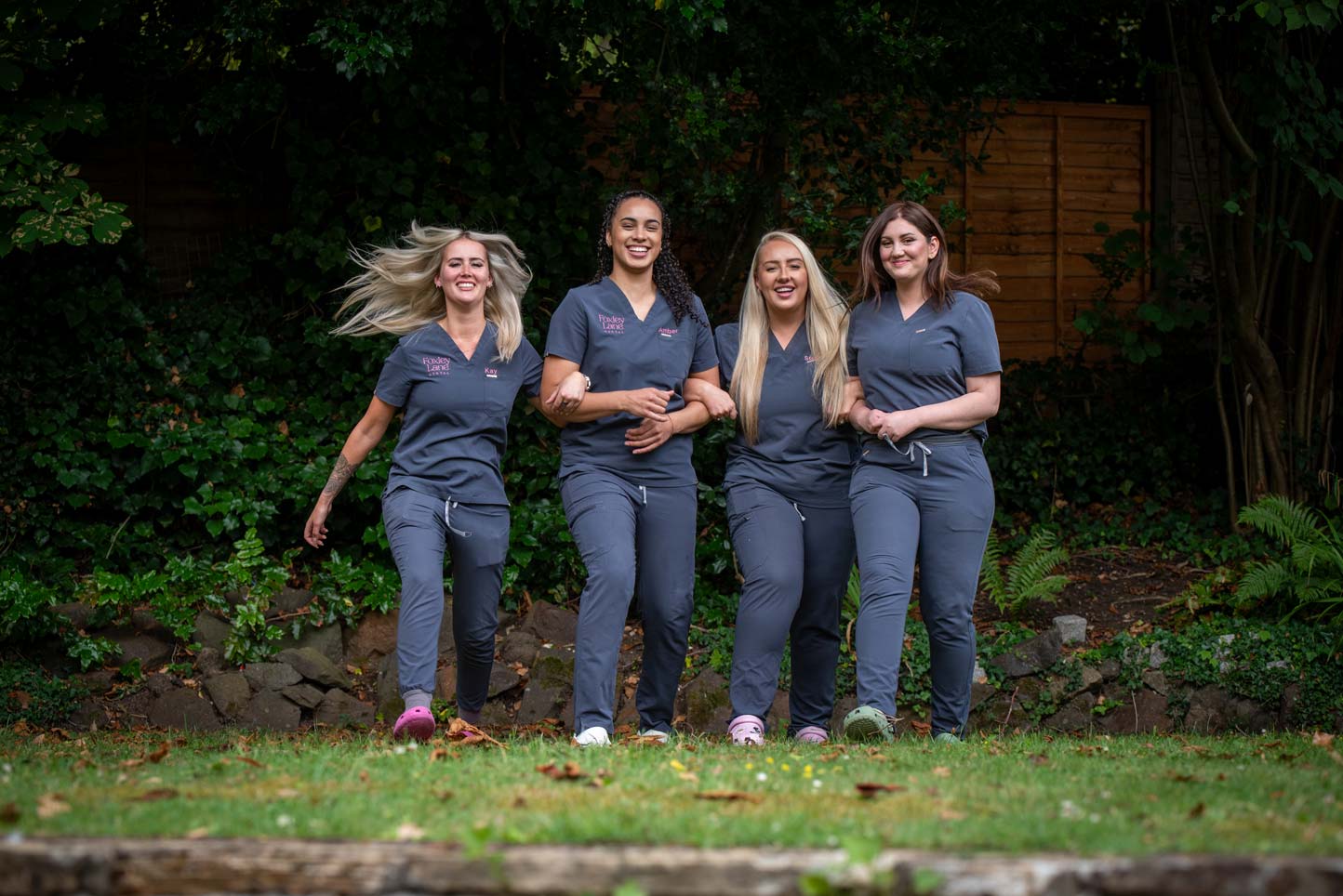 Dental team walking together in the practice garden