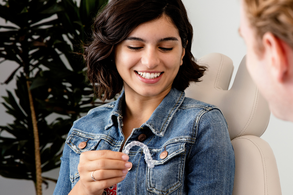 Patient discussing Invisalign clear aligners during a consultation at a dental practice in Purley