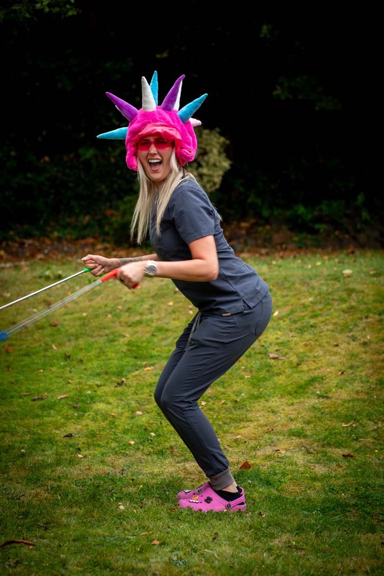 Dental nurse Kayleigh Woolacott enjoying a fun team activity outdoors at the Purley dental practice.