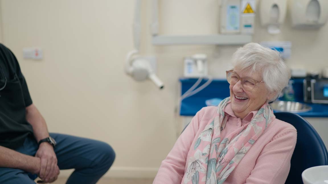 Smiling patient during a consultation for All-on-4 dental implants at Foxley Lane Dental in Purley