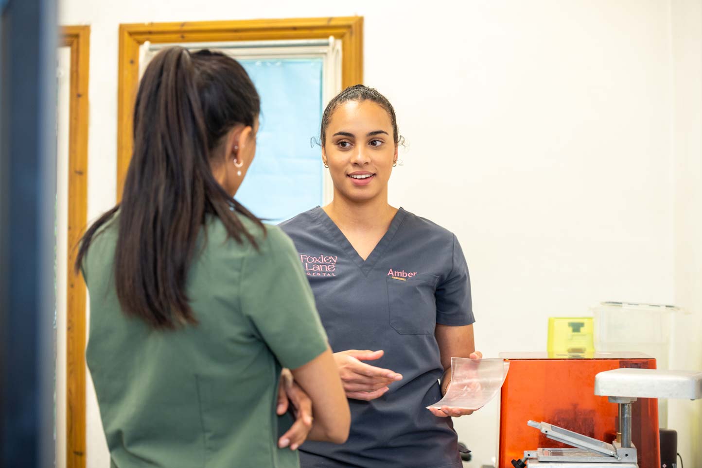 Dental professionals Punita Shah and Amber Payne explaining a treatment plan during a dental check-up consultation.