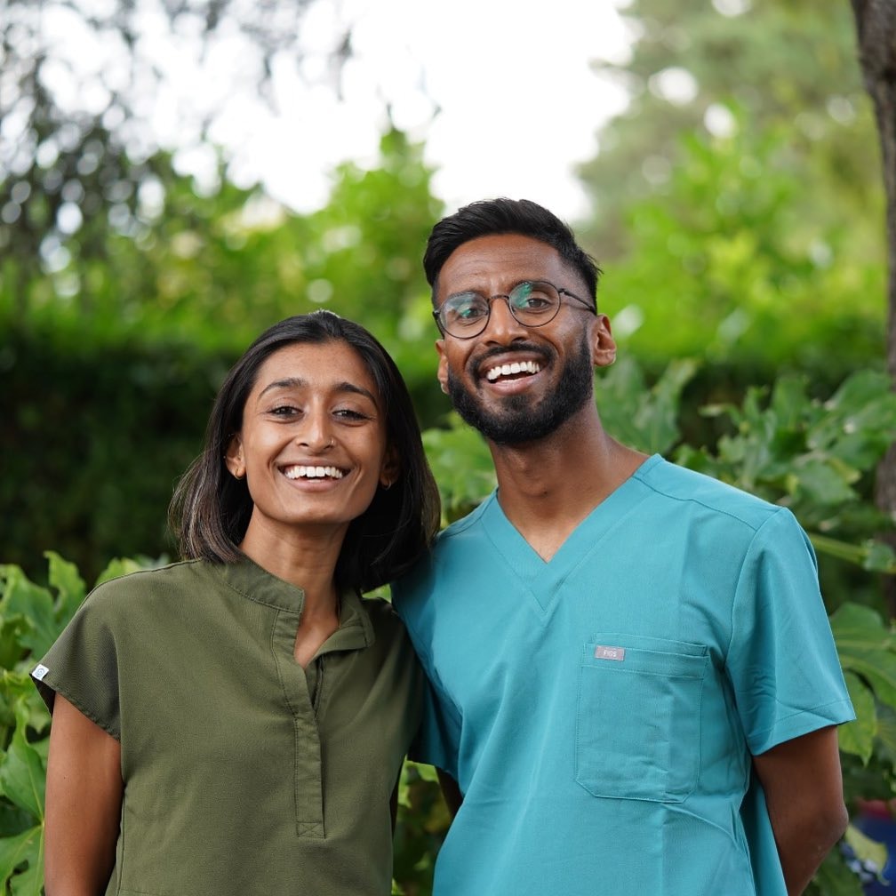 Two smiling cosmetic dentists.