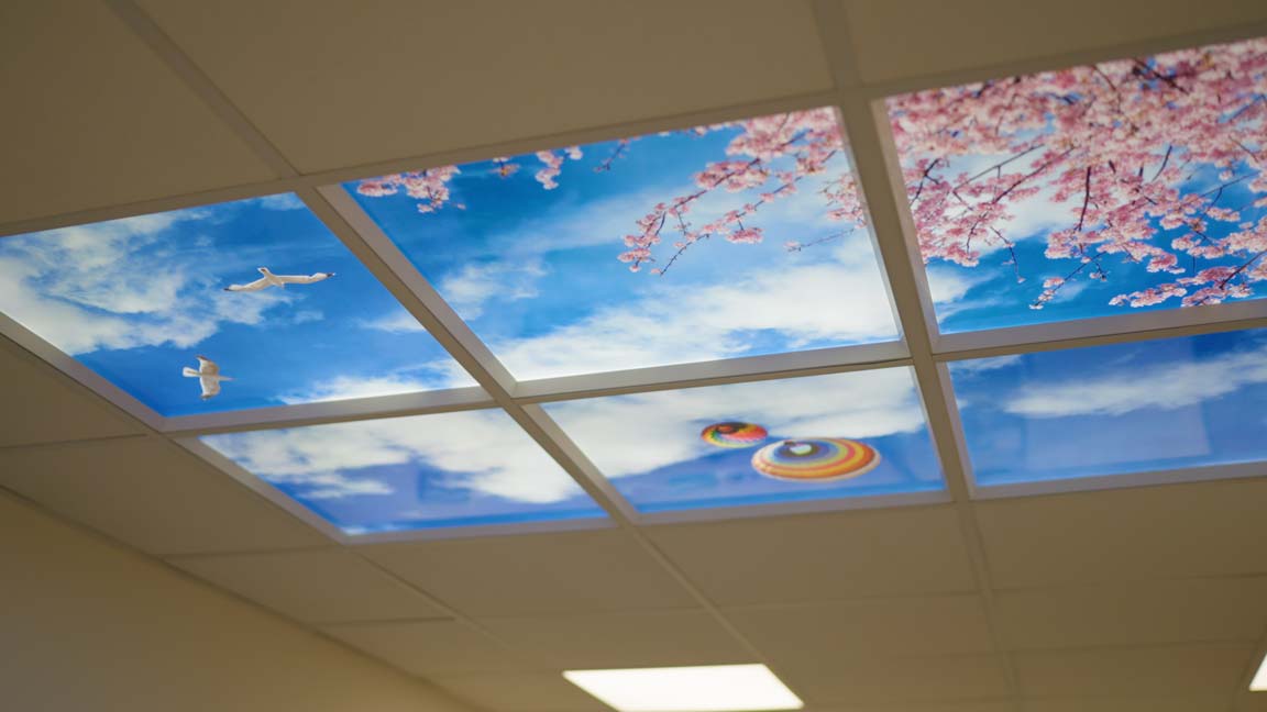 A calming cloudy sky scene on the ceiling of a dentist surgery.