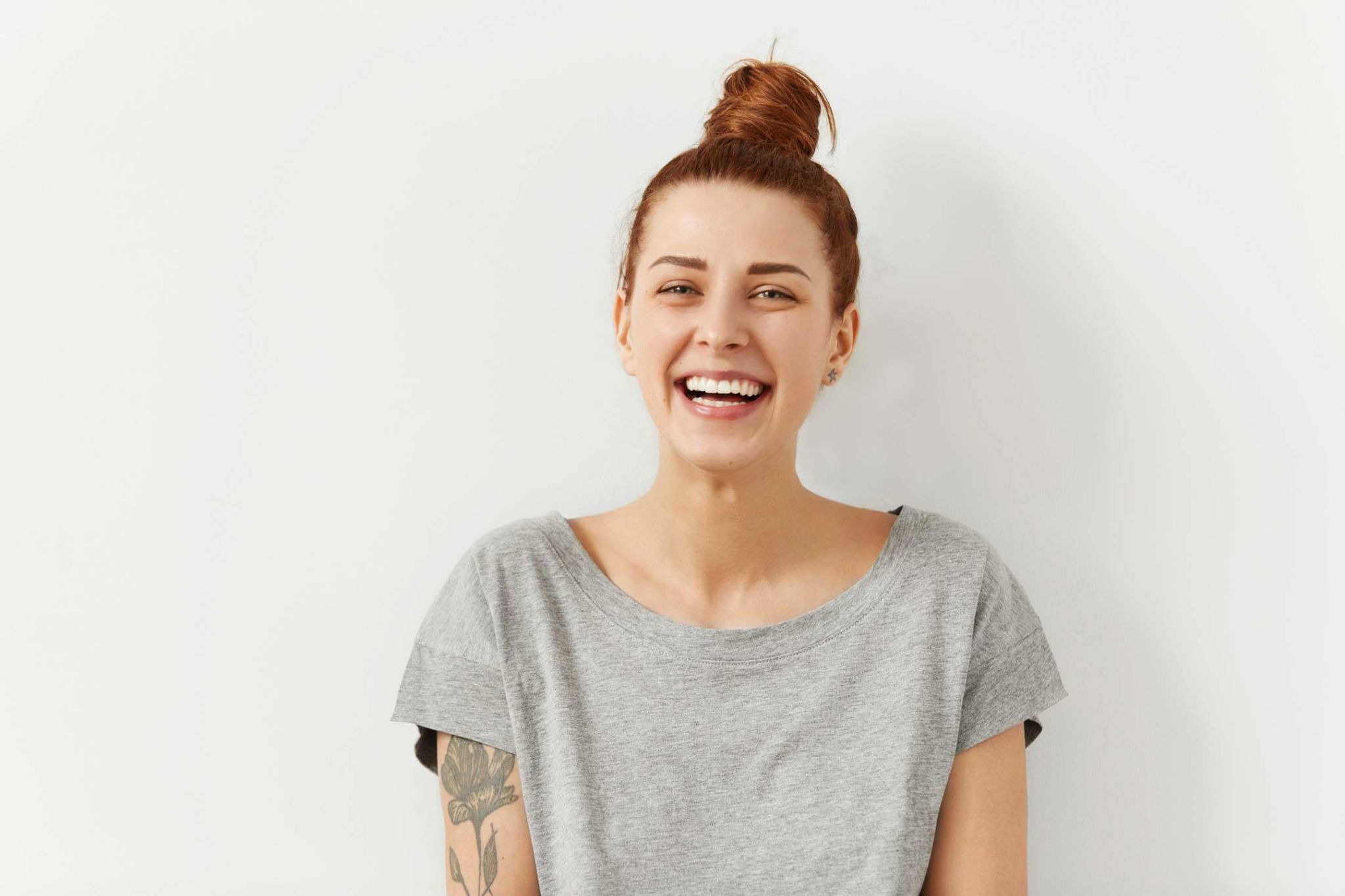 Woman smiling with healthy natural teeth demonstrating a confident smile result similar to cosmetic dentistry treatments in Purley