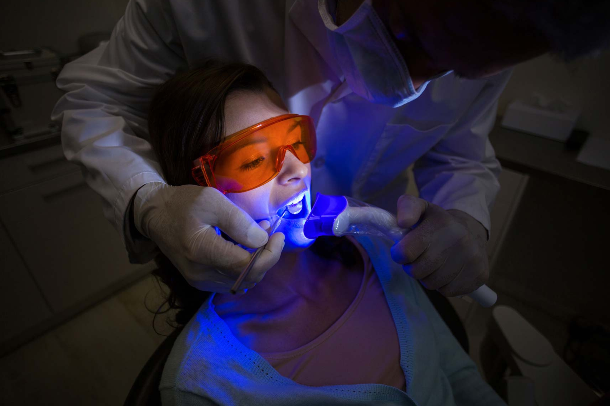 Patient receiving in-chair laser teeth whitening treatment at cosmetic dentist in Purley