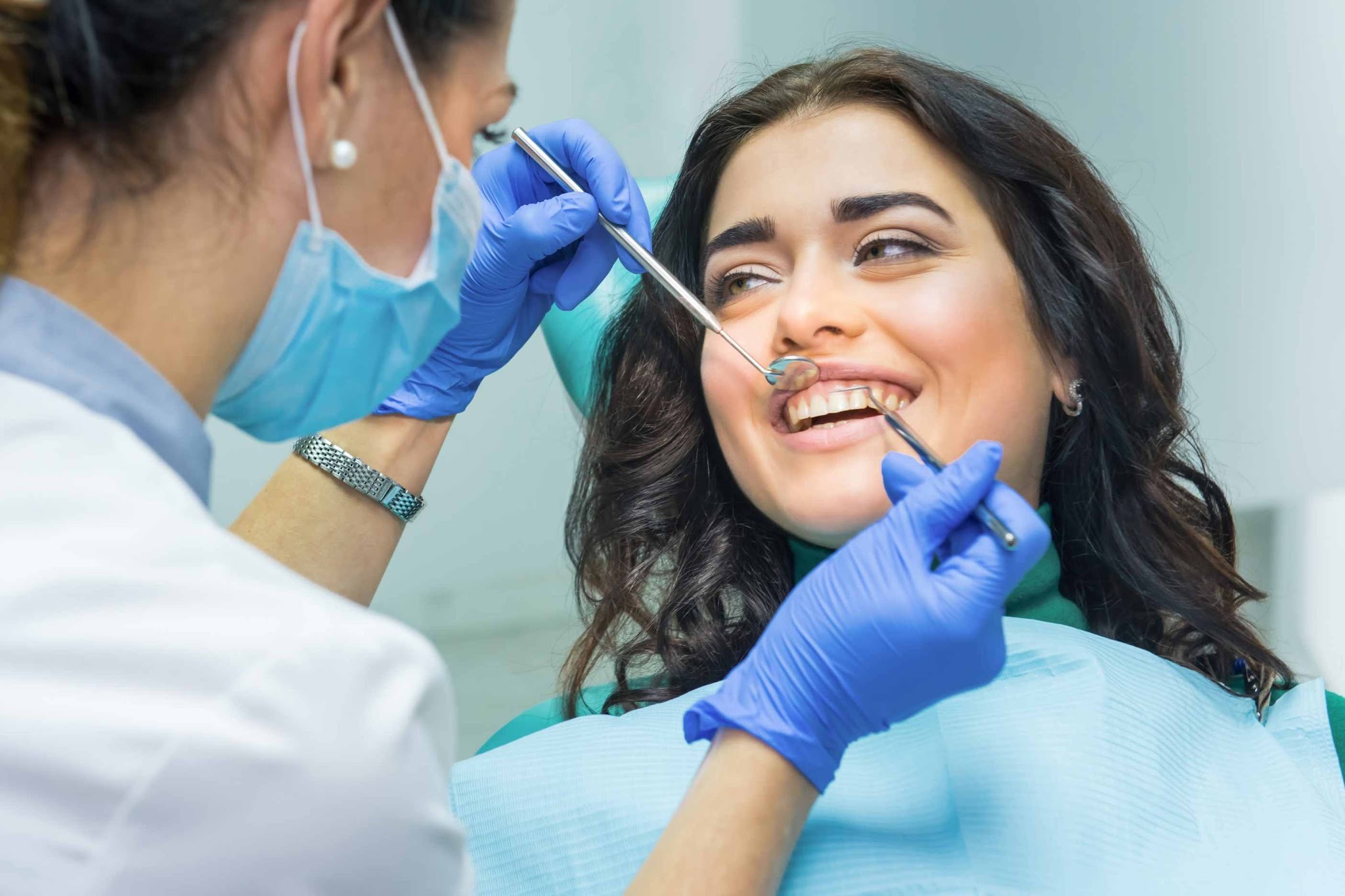 Patient attending cosmetic dentistry consultation for porcelain veneers in Purley